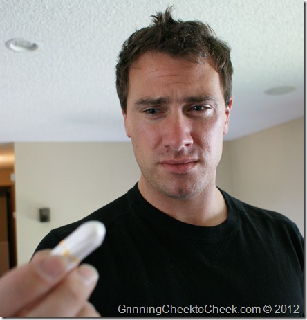 man holding tampon