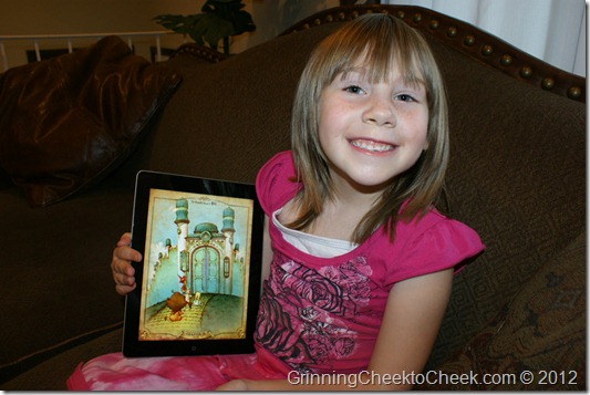 girl with storybook on tablet