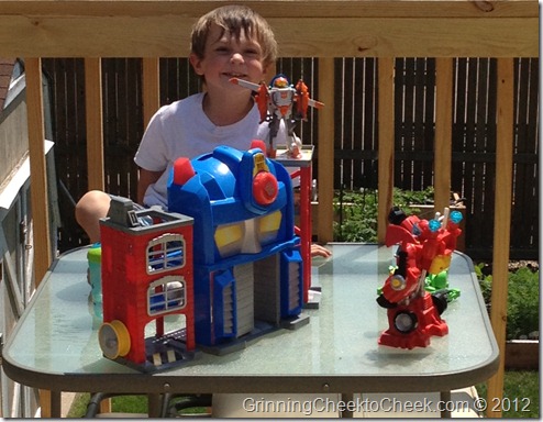 boy with Optimus Prime fire station