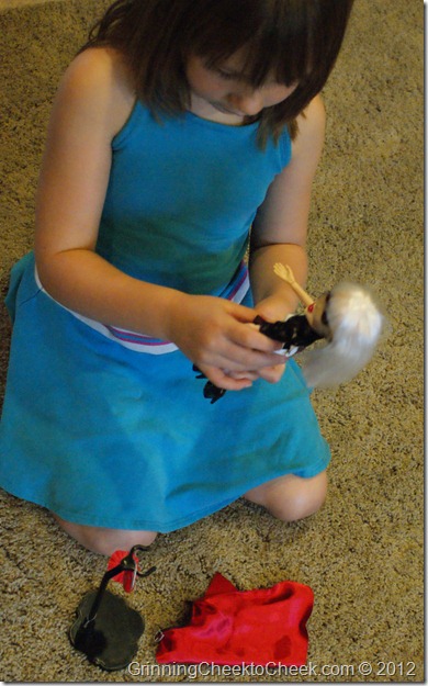 Girl Playing with Good Witch Doll