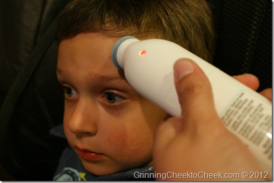 Boy with Forehead Thermometer