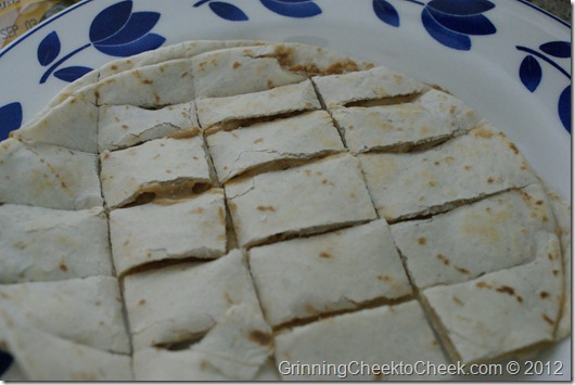 preparing the quesadilla