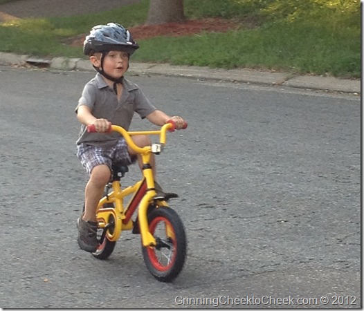 boy learning to ride a bike